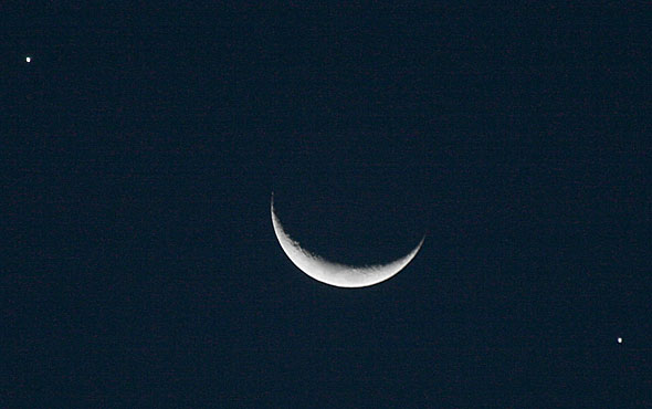 Crescent moon and planets in alignment